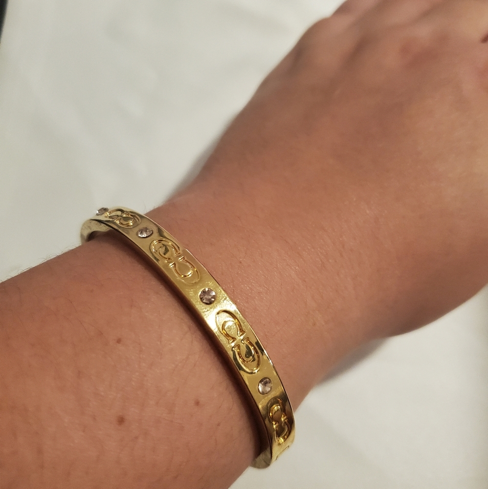COACH gold tone bangle